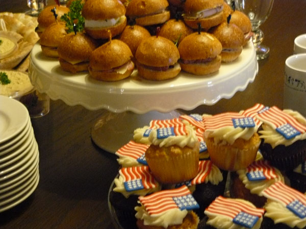 buffet with cupcakes and sandwiches